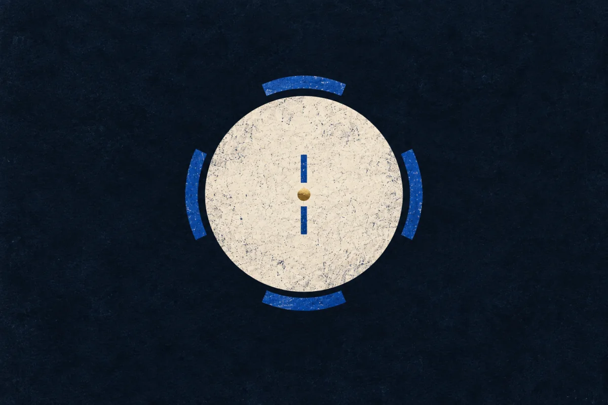A large ivory disc bears a curving sequence of cobalt dots around a small gold centre.